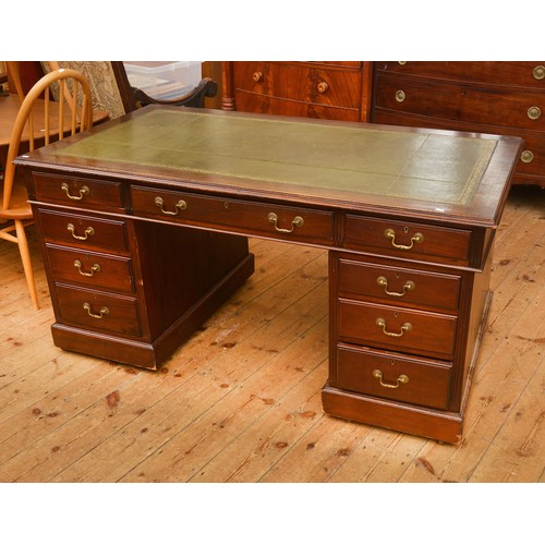 588 - An Edwardian Mahogany Partner's Desk with fitted insets, Leather Gilded Top & resting on banks of Dr... 