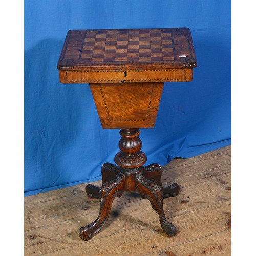 598 - A Victorian Walnut veneered Chess Top Needlework Table resting on a carved Tripod Fluted Base. Measu... 