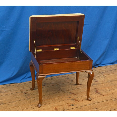 610 - A Mahogany Tapestry Topped Piano Stool resting on pad feet.