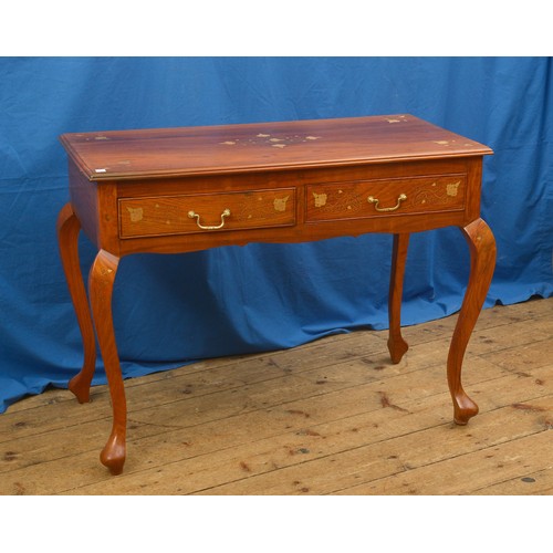 617 - An Indian Brass & Copper Floral inlaid Two Drawers Side Table resting on pad feet. Measuring: 101cms... 