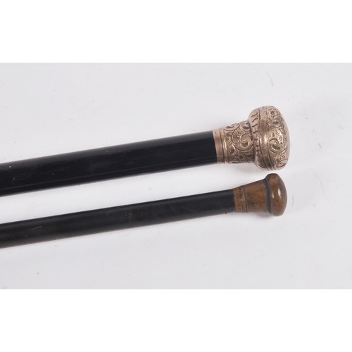 652 - Two Silver Topped Walking Sticks.