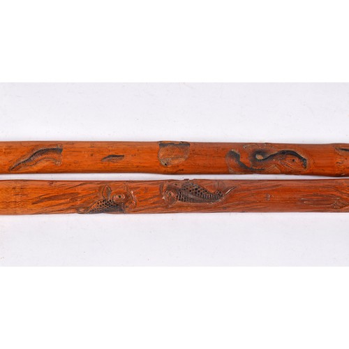 653 - Three Japanese Bamboo Walking sticks including two which are carved.