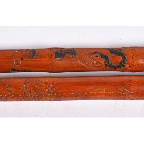 653 - Three Japanese Bamboo Walking sticks including two which are carved.