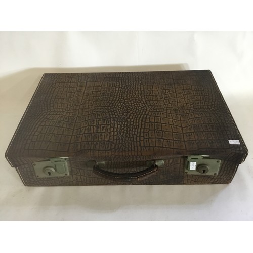 668 - A Crocodile Skin effect Suitcase.