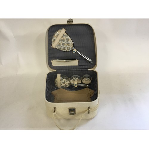 674 - A 1950s Vanity Case in Cream Fitted with a Dressing Table Set along with vintage collars.