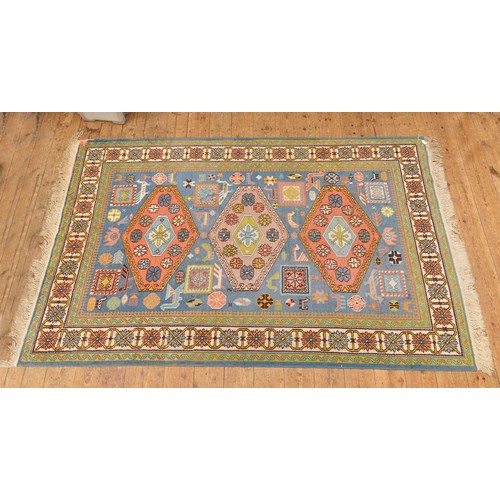 683 - A Blue Ground Triple Bordered Three Gull Eight Block Green, Pink & Ivory Rug. Measuring: 250cms x 16... 