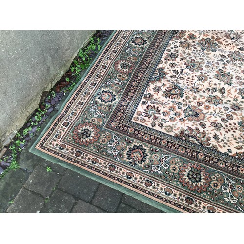 695 - A Large Green Floral Bordered Central Flower designed Wilton Carpet & a similar Smaller Rug. Large R... 