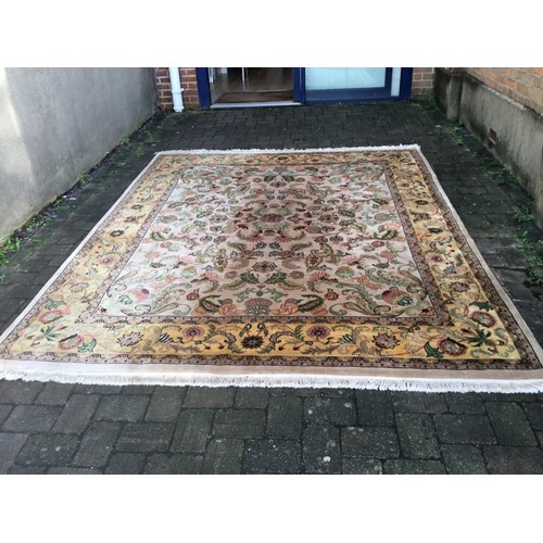 699 - A Sage Green Ground Yellow Floral bordered Scroll & Flower Head Carpet with a Large Green & Yellow S... 