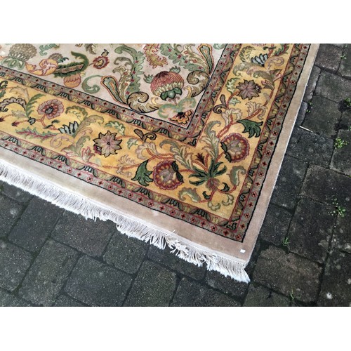 699 - A Sage Green Ground Yellow Floral bordered Scroll & Flower Head Carpet with a Large Green & Yellow S... 