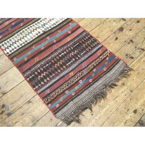 703 - A Turkish Kilim Runner. Measuring: 370cms x 73cms.