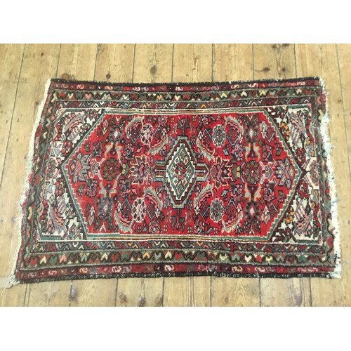 704 - A Mid 20th Century Qashqai Rug. Measuring: 113cms x 76cms.