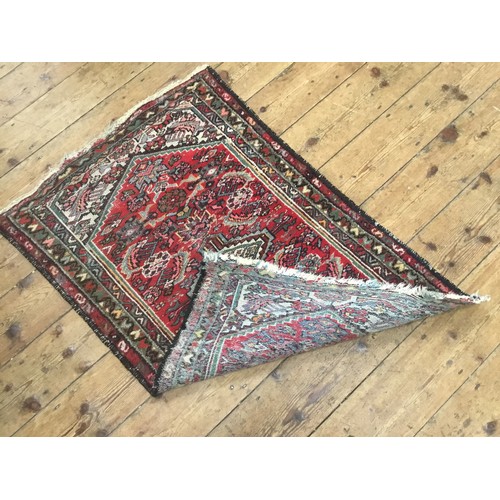 704 - A Mid 20th Century Qashqai Rug. Measuring: 113cms x 76cms.