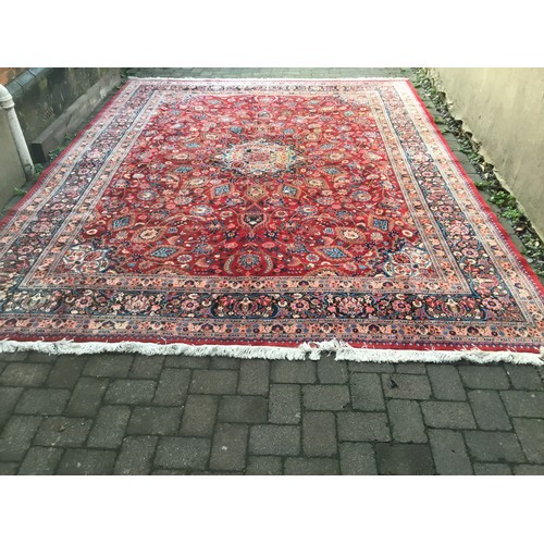 705 - A Very Large Genuine Persian/Iranian Woollen Rug in a typical Herati pattern or Garden design. Measu... 