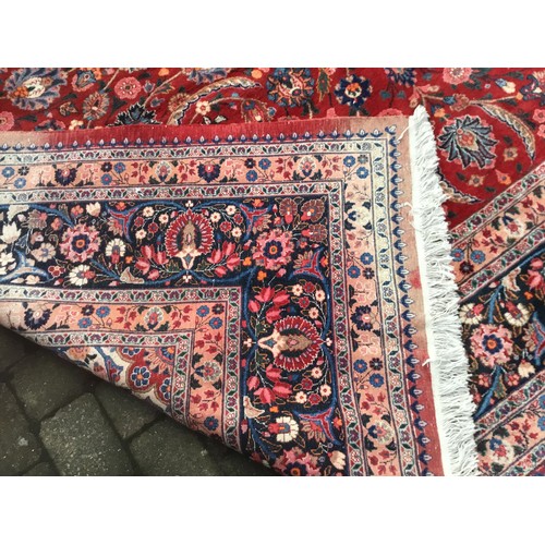 705 - A Very Large Genuine Persian/Iranian Woollen Rug in a typical Herati pattern or Garden design. Measu... 