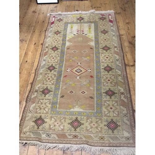 707 - A Hand Made Turkish Rug with Geometric design. Measuring: 212cms x 115cms.