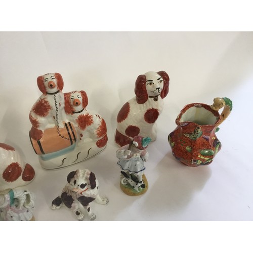 729 - Three Staffordshire Flat Back Spaniel Ornaments, a German Spaniel, Two Jugs, etc.