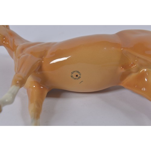 730 - A Beswick Tan Glazed White Spot Tail & Forward Legs study of a Palomino. Standing: 19cms high.