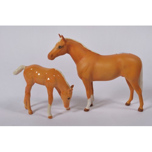 731 - A Beswick Tan Buff Palomino Horse with a White Mane & Tail & Socks. Standing: 14cms high. Along with... 