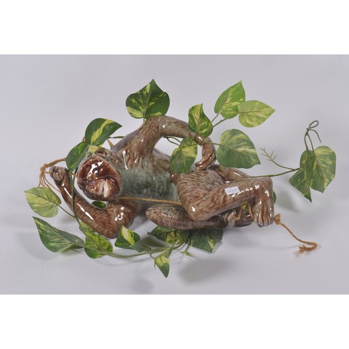 732 - A Plant Conservatory Pottery Study of a Brown Glazed Monkey. Measuring: 36cms.