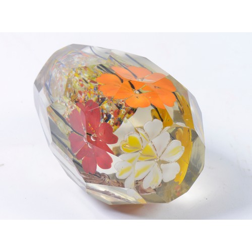 805 - An interesting Nailsea Glass Dump Weight with faceted Shape & Summer Flowers. Measuring: 11cms high.