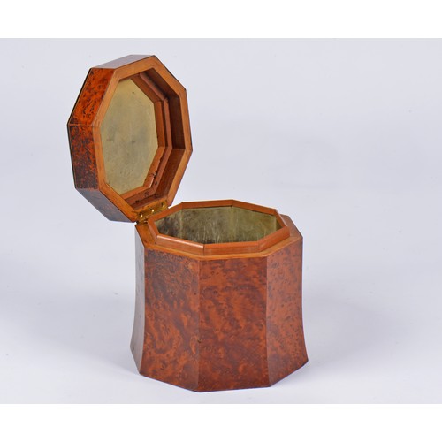 824 - A Hexagonal Tea Caddy in Amboyna Wood with line inlay.