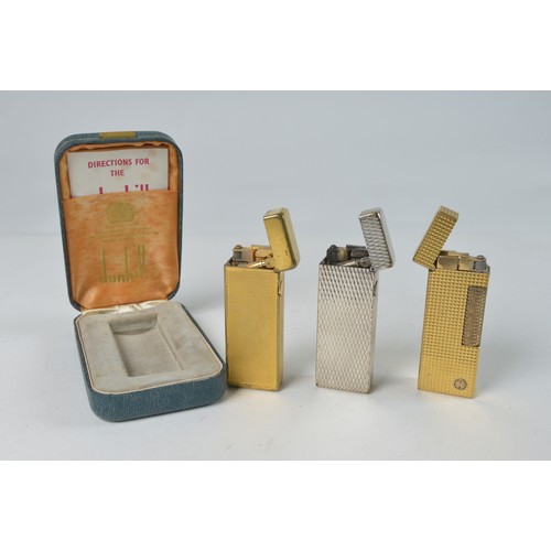 827 - Three Dunhill Cigarette Lighters one in Original Box.