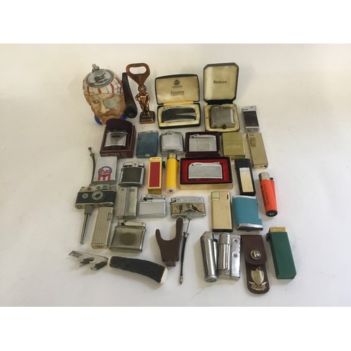 831 - A Collection of Lighters to include Ronson, Mosda, Pirate, Bebe, Camera on Stand, etc.