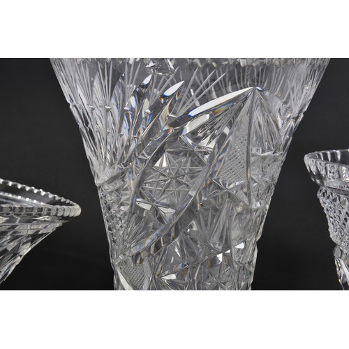 941 - A Heavy Diamond Cut Glass Vase along with three other Vases.