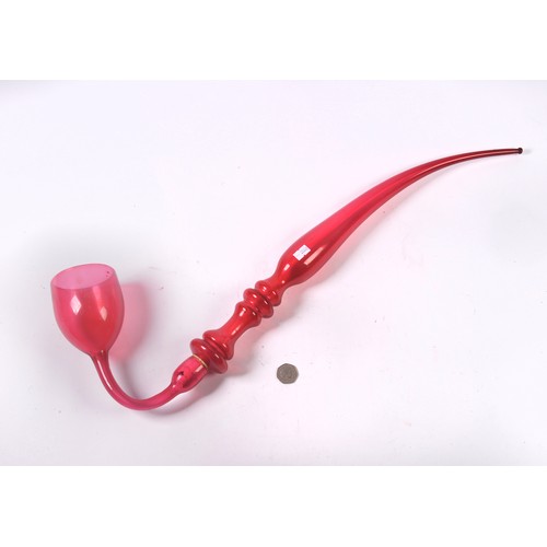 951 - A Late 19th Century Cranberry Glass Ruby tinted Apprentice Glass Makers Pipe. Measuring: 70cms Long.