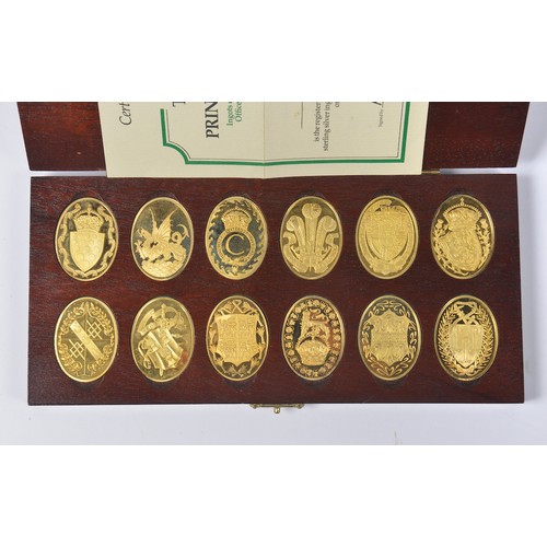 13 - A Danbury Mint Boxed Set of 12 x 22k Gold Plated Ingots marking 