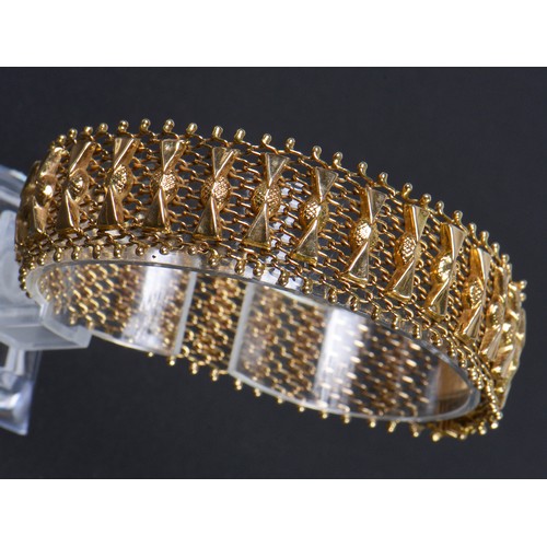 30 - A Ladies 18ct Gold Ribbon & Mesh Flexible Bracelet. Weighing: 33.7 grams.