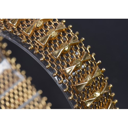 30 - A Ladies 18ct Gold Ribbon & Mesh Flexible Bracelet. Weighing: 33.7 grams.