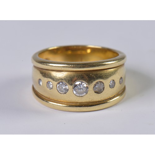 33 - An 18ct Gold & ribbed edged Diamond Ring inset with seven Diamonds. Weighing: 9.1 grams. Size: M.