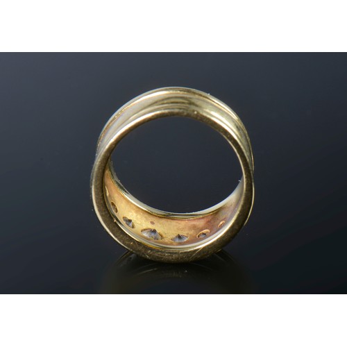 33 - An 18ct Gold & ribbed edged Diamond Ring inset with seven Diamonds. Weighing: 9.1 grams. Size: M.