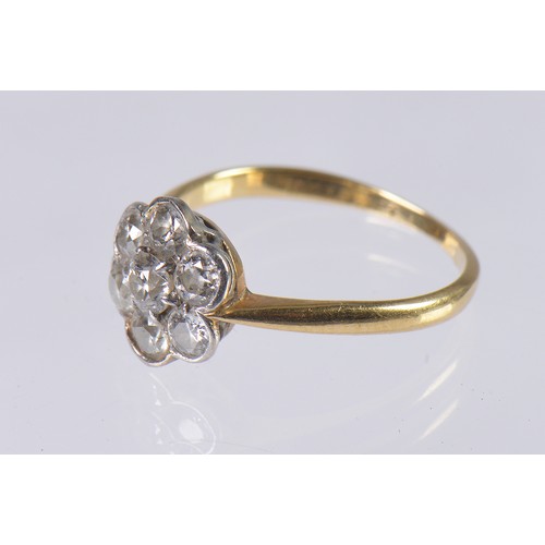 41 - A Ladies 18ct Gold & Seven Stone Diamond Cluster Ring. Size: M. Weighing: 2.6 grams.