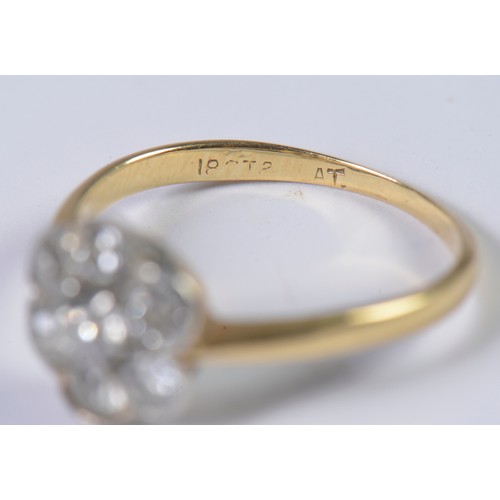 41 - A Ladies 18ct Gold & Seven Stone Diamond Cluster Ring. Size: M. Weighing: 2.6 grams.