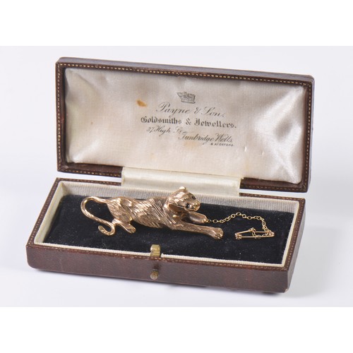 42 - A 9ct Gold Chiseled & Cut Panther Brooch with inset stones on safety chain. Weighing: 6.9 grams.