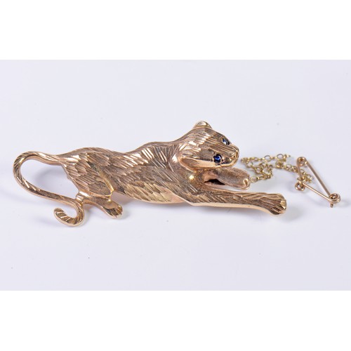 42 - A 9ct Gold Chiseled & Cut Panther Brooch with inset stones on safety chain. Weighing: 6.9 grams.