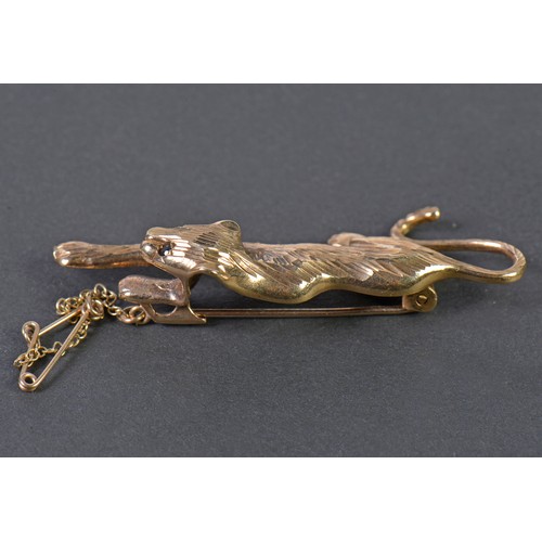 42 - A 9ct Gold Chiseled & Cut Panther Brooch with inset stones on safety chain. Weighing: 6.9 grams.