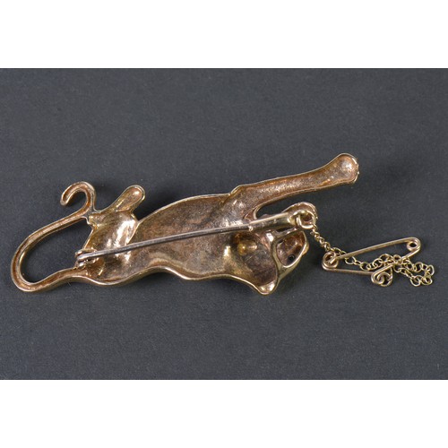 42 - A 9ct Gold Chiseled & Cut Panther Brooch with inset stones on safety chain. Weighing: 6.9 grams.