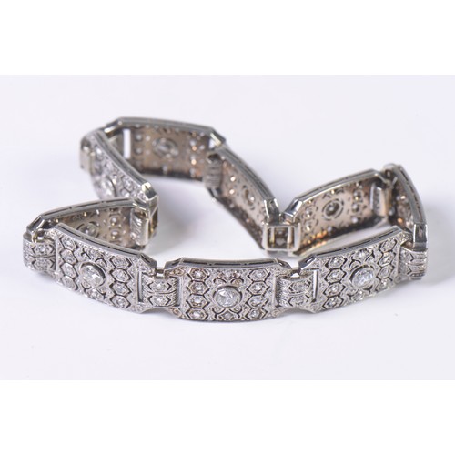 44 - A Ladies Art Deco Platinum & Diamond central mounted Three & Four Lozenges & a Flip-Over Clasp. Weig... 