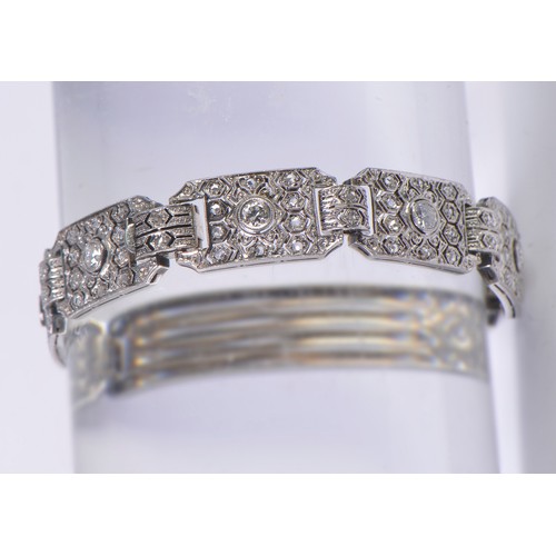 44 - A Ladies Art Deco Platinum & Diamond central mounted Three & Four Lozenges & a Flip-Over Clasp. Weig... 