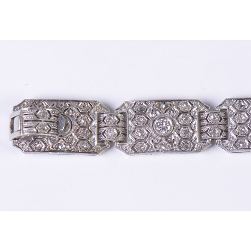 44 - A Ladies Art Deco Platinum & Diamond central mounted Three & Four Lozenges & a Flip-Over Clasp. Weig... 