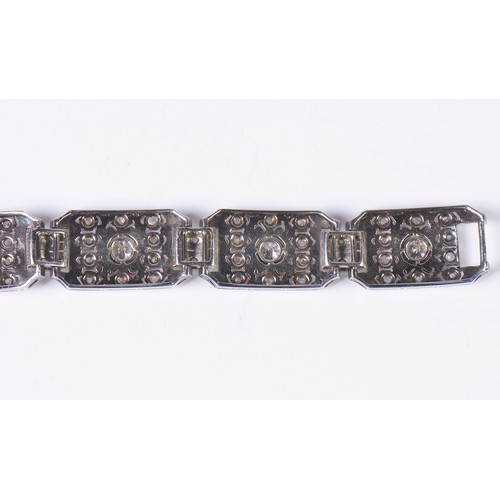 44 - A Ladies Art Deco Platinum & Diamond central mounted Three & Four Lozenges & a Flip-Over Clasp. Weig... 