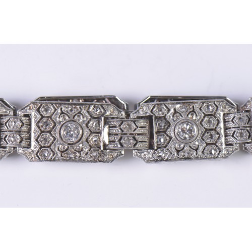 44 - A Ladies Art Deco Platinum & Diamond central mounted Three & Four Lozenges & a Flip-Over Clasp. Weig... 