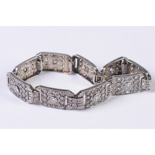 44 - A Ladies Art Deco Platinum & Diamond central mounted Three & Four Lozenges & a Flip-Over Clasp. Weig... 