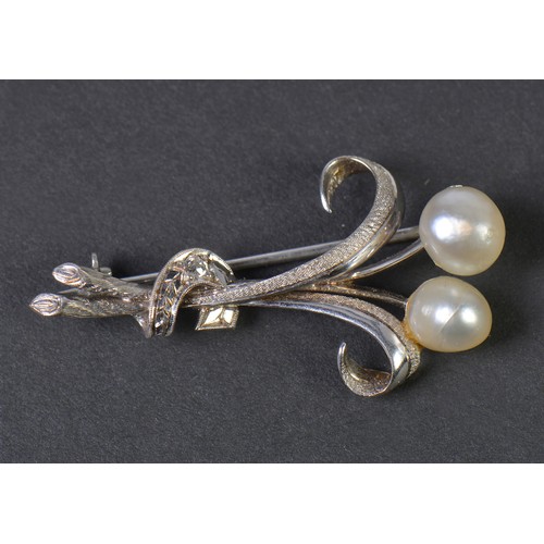 46 - A 1950s Diamond mounted Twin Pearl Floral Spray Brooch with a textured finish.