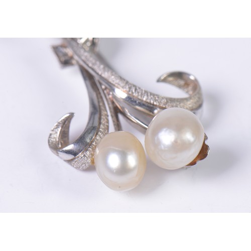 46 - A 1950s Diamond mounted Twin Pearl Floral Spray Brooch with a textured finish.