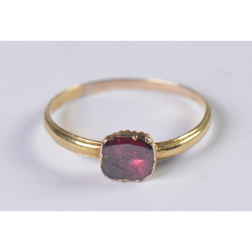 47 - A Georgian Garnet Ring with a Fold over setting. Size: R. Weighing: 1.6 grams.