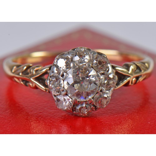 48 - A Ladies Diamond Cluster Ring set with a Central Stone & Eight Diamonds on a Pierced Open Work setti... 